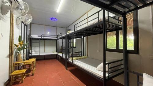 Ένα ή περισσότερα κρεβάτια σε δωμάτιο στο Om Tara Retreat