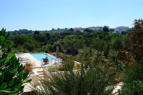 Πισίνα στο ή κοντά στο Trullo Mamamè