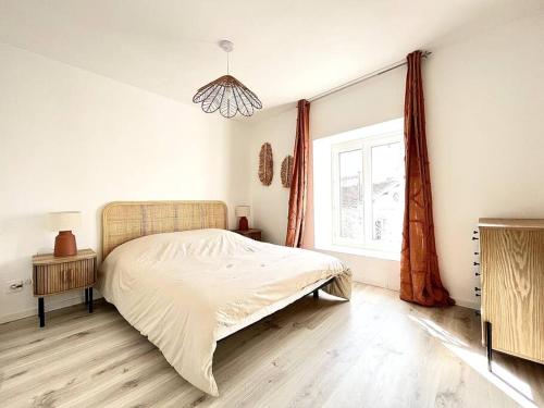 Postel nebo postele na pokoji v ubytování L'Ambre rouge - Romans