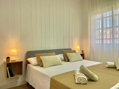 a bedroom with two beds with pillows on them at Las Brisas 1 by SunHousescanarias in Las Palmas de Gran Canaria