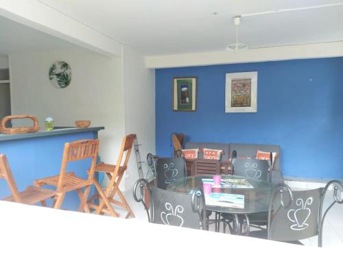 a dining room with a table and chairs at Appartement d'une chambre avec jardin clos et wifi a La Trinite in La Trinité