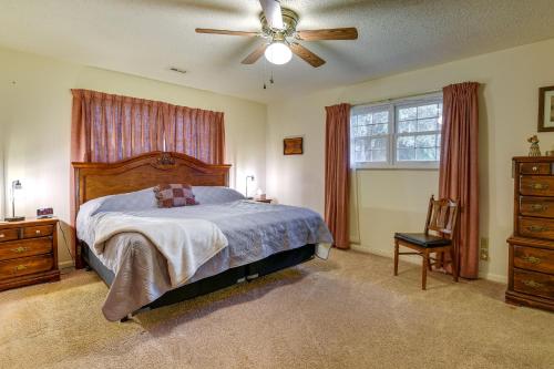 a bedroom with a bed and a ceiling fan at Vintage Chipley Getaway on Large Private Property in Chipley