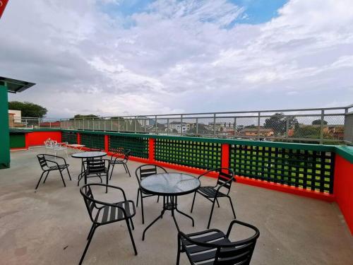 a group of tables and chairs on a roof at Ipoh town centre glamping home 13pax in Ipoh