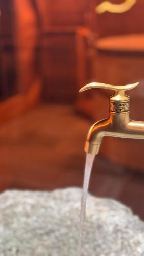 a stream of water coming out of a faucet at ValmalencoAlpina in Caspoggio