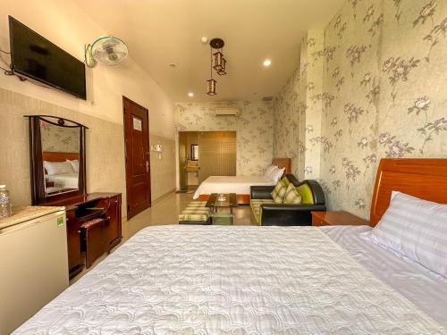 Postel nebo postele na pokoji v ubytování Hotel Phu Hai