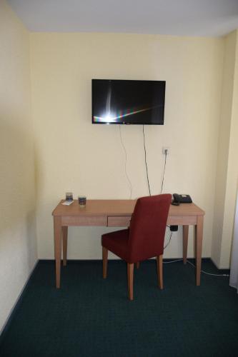 Télévision ou salle de divertissement dans l'établissement Hotel St. Paulushof