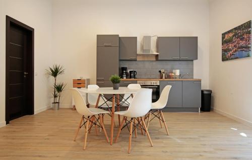 a kitchen with a table and chairs in a room at Apartment im Fun4you in Wiesloch