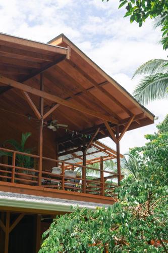 a wooden building with awnings on top of it at TropicalArts Resort&Studios in Bocas del Toro