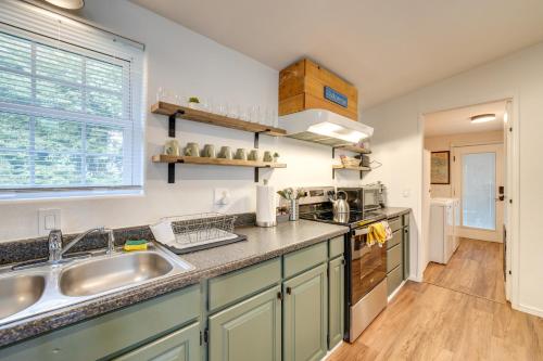 a kitchen with a sink and a counter top at Lakefront Mount Vernon Home with Private Dock! in Mount Vernon
