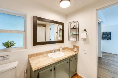 a bathroom with a sink and a mirror at Lakefront Mount Vernon Home with Private Dock! in Mount Vernon