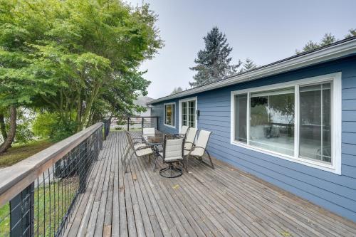 a deck with chairs and a table on a house at Lakefront Mount Vernon Home with Private Dock! in Mount Vernon