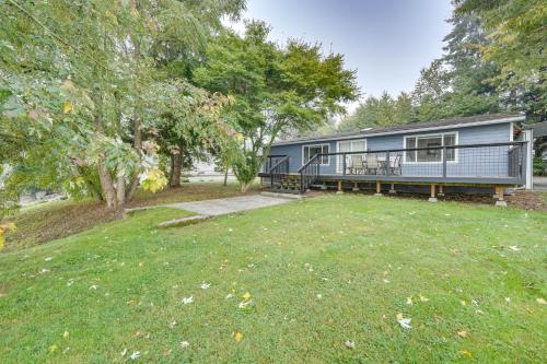 a mobile home in a yard with trees at Lakefront Mount Vernon Home with Private Dock! in Mount Vernon