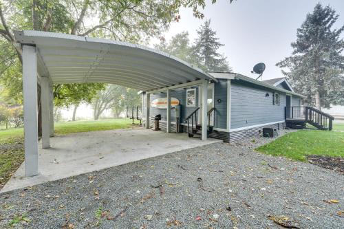 a house with a cover over a patio at Lakefront Mount Vernon Home with Private Dock! in Mount Vernon
