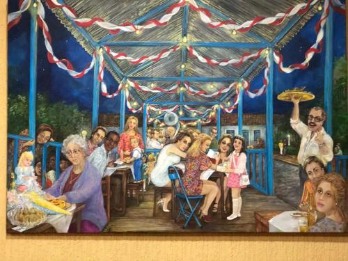 a painting of a group of people in a carousel at Hotel Villa de Minas in Monte Sião
