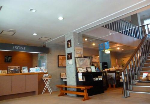 a room with a staircase and a bench in a building at Hakodate Motomachi Hotel in Hakodate