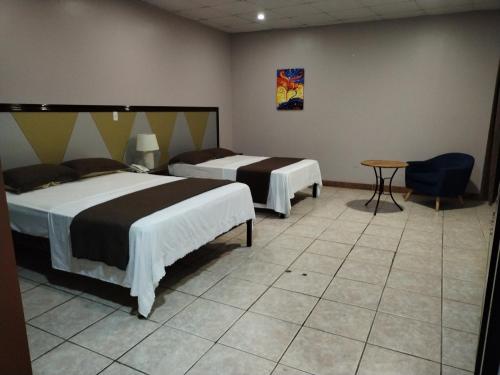 Katil atau katil-katil dalam bilik di Hotel America - La Chorrera