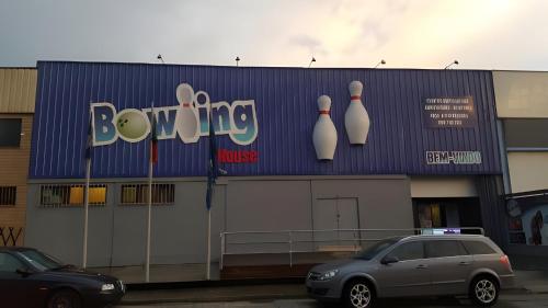 a building with a bowling house sign on it at Casa do Alto (top floor apartment) in Adaúfe