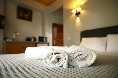 a pile of towels sitting on top of a bed at NarPera Taksim Boutique Hotel in Istanbul