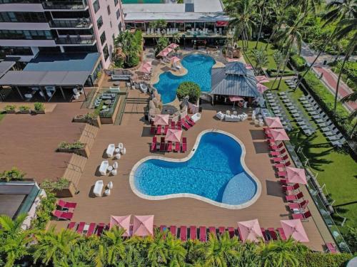 an aerial view of a resort with two swimming pools at Gorgeous Miami Beach Condo Beach Service 1614 in Miami Beach