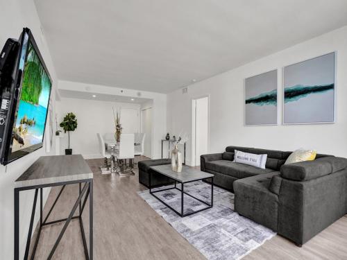 a living room with a couch and a table at Gorgeous Miami Beach Condo Beach Service 1614 in Miami Beach