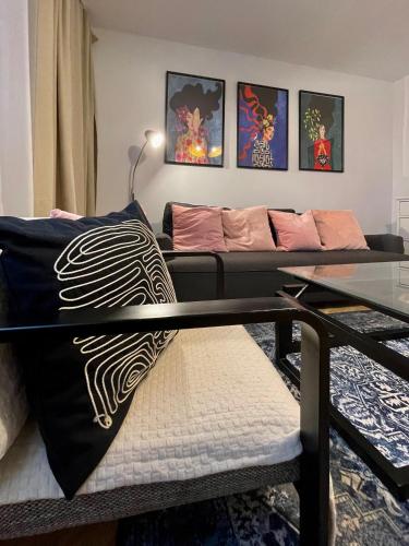 a living room with a couch and a table at Apartament KaMaRo in Słubice