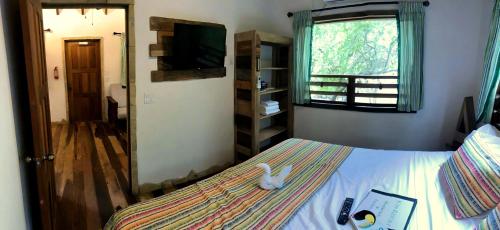 Postel nebo postele na pokoji v ubytování Kin Resort Lodge
