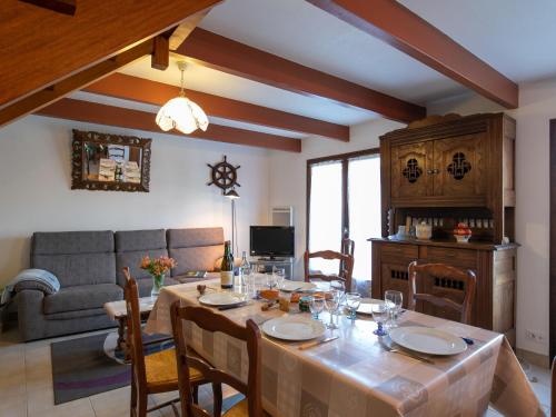 a living room with a table and a couch at Holiday Home Ty Pendruc by Interhome in Trégunc