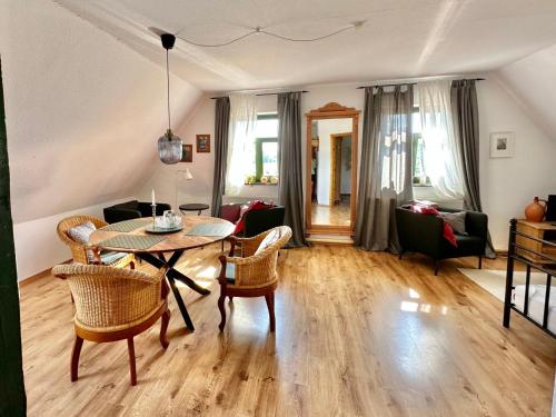 a living room with a table and chairs at Apartment Hiddensee by Interhome in Dargun