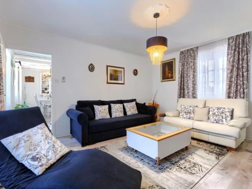 a living room with a couch and a coffee table at Holiday Home Centar by Interhome in Umag