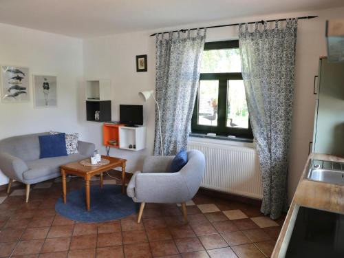 a living room with a couch and chairs and a window at Apartment Fehmarn by Interhome in Dargun