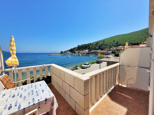 a balcony with a view of the water at Apartment Jelka-2 by Interhome in Trstenik