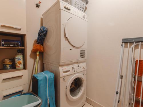 a washer and dryer in a bathroom with a washing machine at Chalet Königsleiten 3 by Interhome in Königsleiten