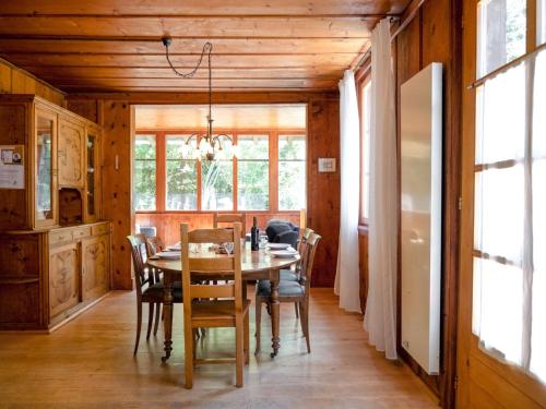 a dining room with a table and chairs at Chalet Dufaux by Interhome in Champex