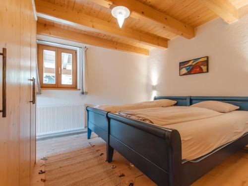 a bedroom with two beds and a window at Apartment Hajenuis TOP OG by Interhome in Königsleiten