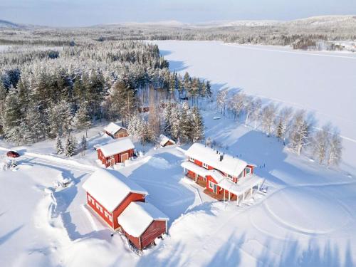 an aerial view of a resort in the snow at Holiday Home Villa lehtoniemi by Interhome in Sonka