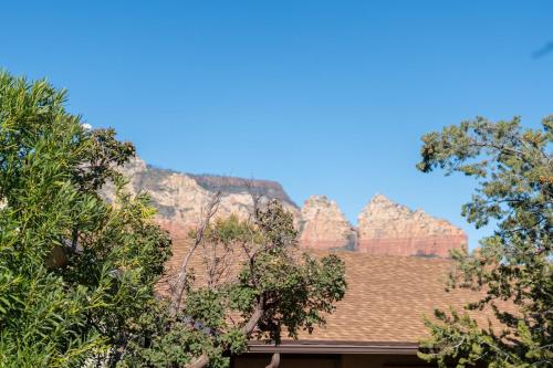 a roof of a house with mountains in the background at Large Spanish Villa -Hot tub- Pool -Gym- Game Room in Sedona