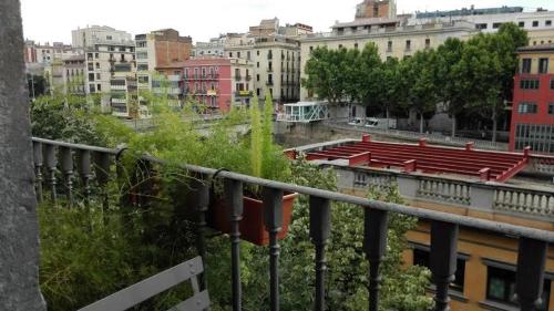 a view of a city from a balcony at Bed & Breakfast Bells Oficis in Girona