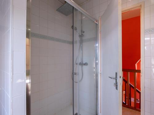 a shower with a glass door in a bathroom at Holiday Home Tal ar Mor by Interhome in Le Pouldu