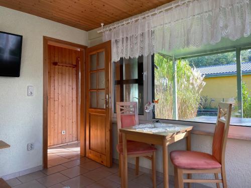 Μια τηλεόραση ή/και κέντρο ψυχαγωγίας στο Holiday Home Am Walde-2 by Interhome