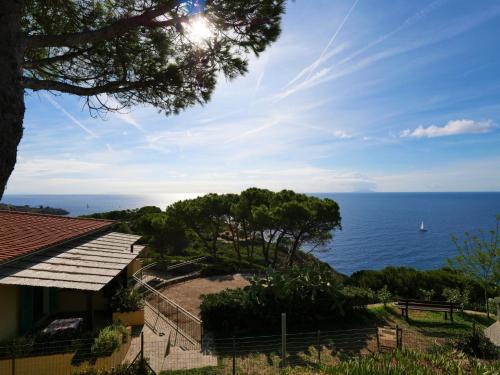 a view of the ocean from a house at Apartment Oasis 1 by Interhome in Capoliveri