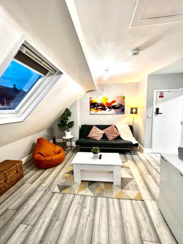 a living room with a couch and a table at DVM escape Flat 3 in Bristol