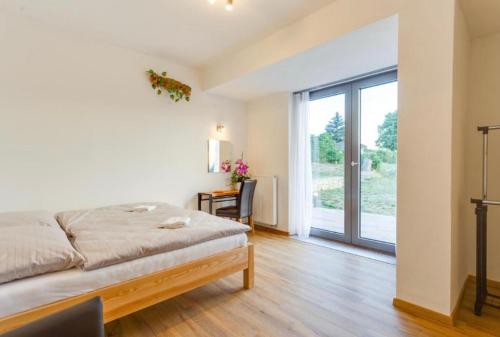 Postel nebo postele na pokoji v ubytování Tilia apartments Březová