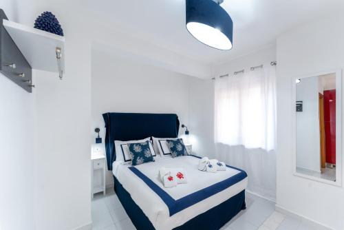 A bed or beds in a room at Corallo apartment