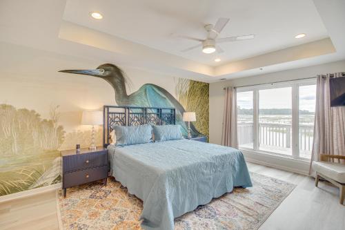 a bedroom with a bed with a bird on the wall at Riverfront Savannah Retreat with Private Dock! in Savannah