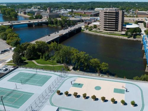 an aerial view of a river with two tennis courts at Courtyard Grand Rapids Downtown in Grand Rapids