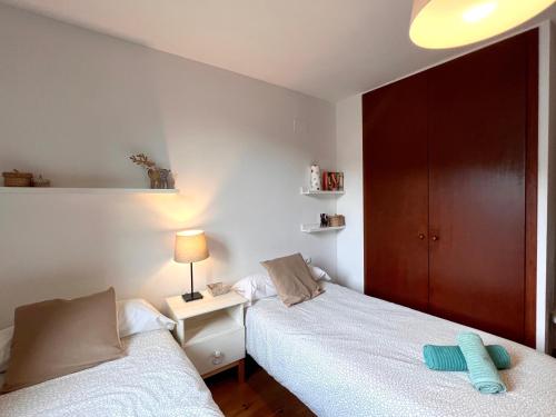 Ένα ή περισσότερα κρεβάτια σε δωμάτιο στο Apartaments del Camp - L'Amfitriona