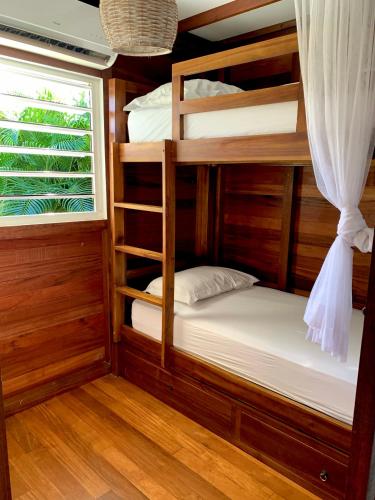 a bedroom with bunk beds and a window at Domaine Saint-François in Saint-François