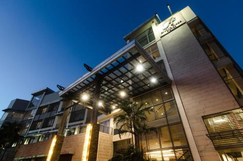 a rendering of a hotel at night at The Avenue Plaza Hotel in Naga