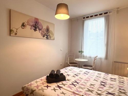 Ένα ή περισσότερα κρεβάτια σε δωμάτιο στο Apartaments del Camp - L'Amfitriona