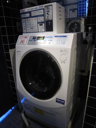 a washing machine in a bathroom with at Hotel Abest Nagano Ekimae in Nagano